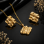 Golden wave textured pendant necklace with matching abstract earrings