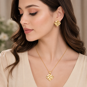 Golden wave textured pendant necklace with matching abstract earrings