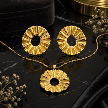 Golden floral sunburst necklace with matching statement earrings set
