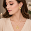 Golden floral sunburst necklace with matching statement earrings set