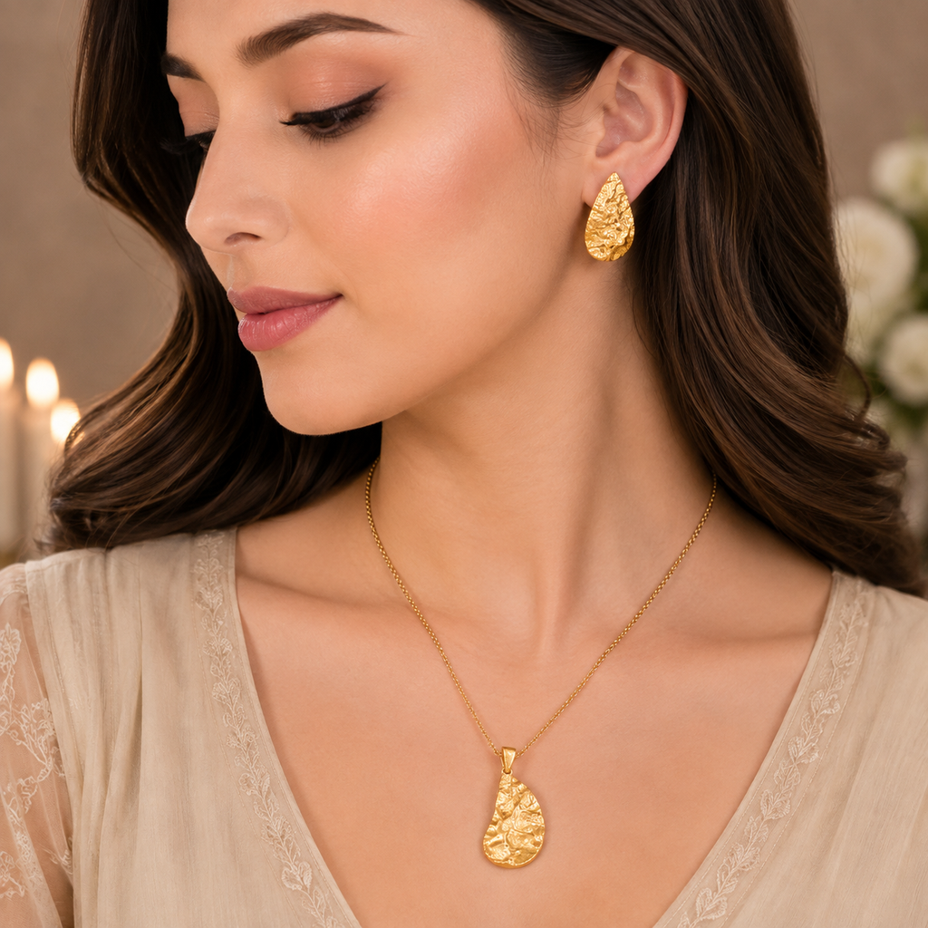 Golden textured leaf necklace with matching leaf-shaped earrings