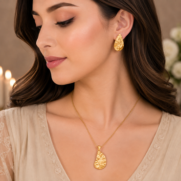 Golden textured leaf necklace with matching leaf-shaped earrings