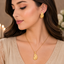 Golden textured leaf necklace with matching leaf-shaped earrings