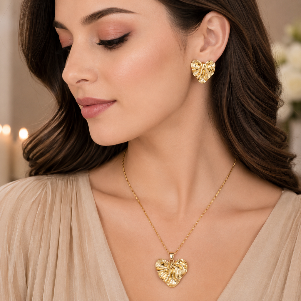 Golden textured heart necklace with matching heart-shaped earrings