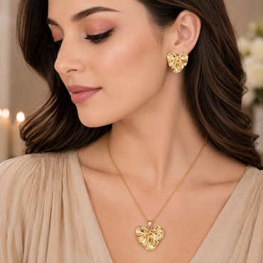 Golden textured heart necklace with matching heart-shaped earrings