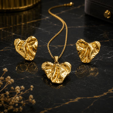 Golden textured heart necklace with matching heart-shaped earrings