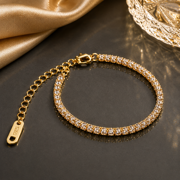 Elegant crystal tennis bracelet in gold and silver tone