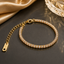 Elegant crystal tennis bracelet in gold and silver tone