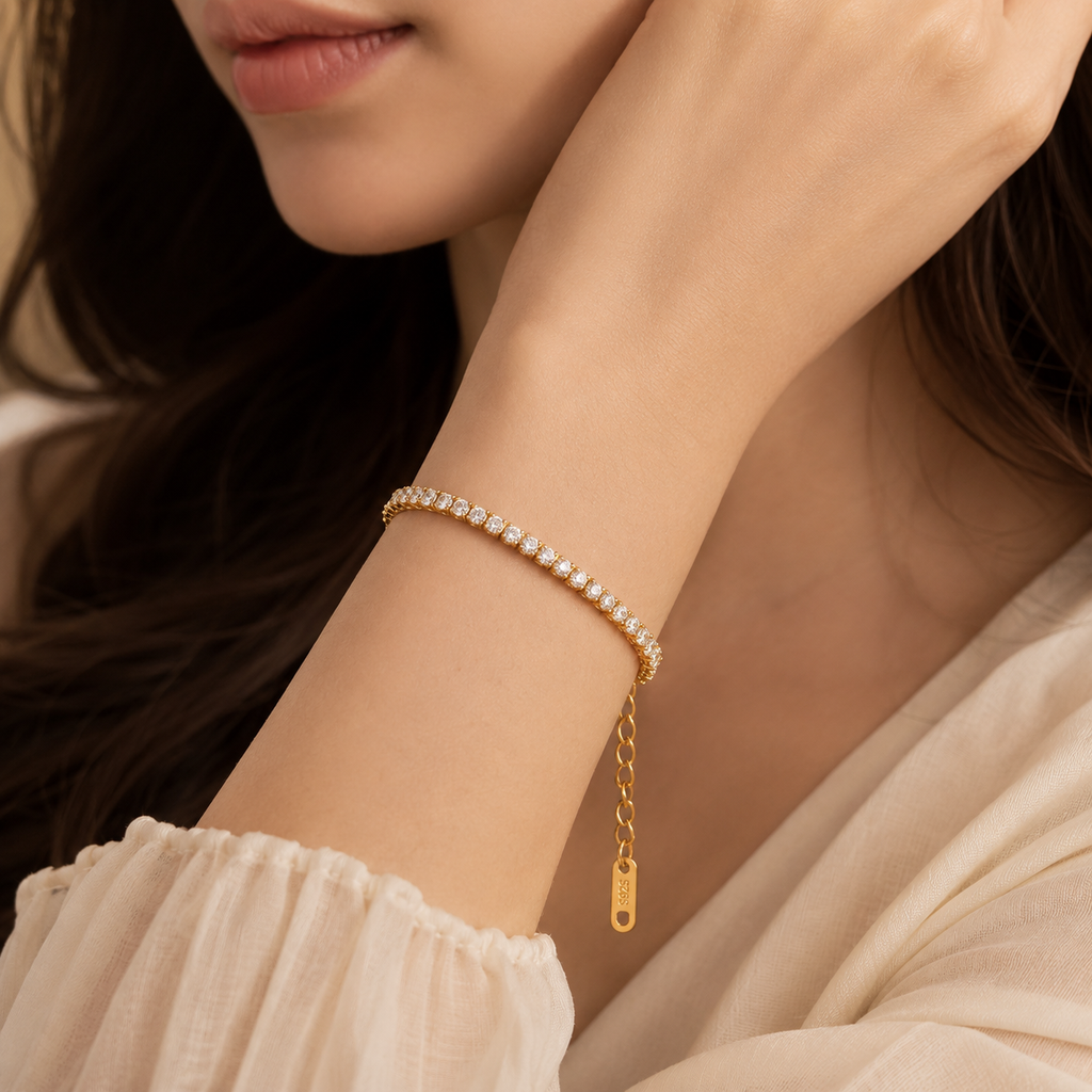 Elegant crystal tennis bracelet in gold and silver tone