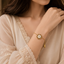Elegant gold floral bracelet with white flower detailing for women