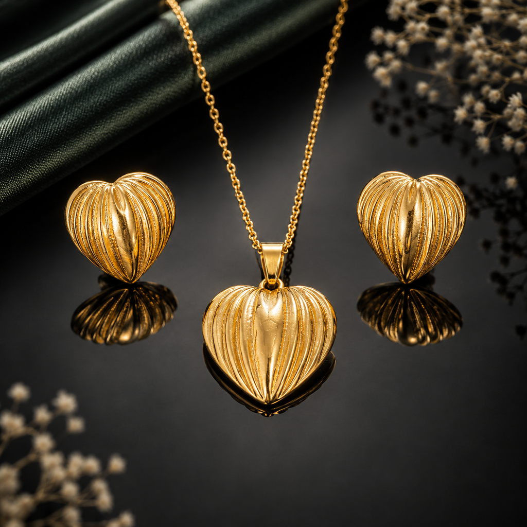 Golden heart pendant necklace with matching textured heart earrings