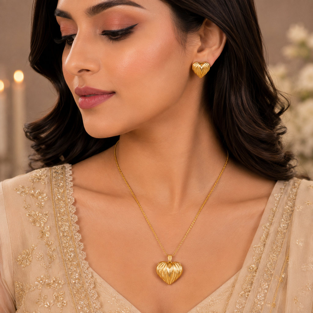 Golden heart pendant necklace with matching textured heart earrings