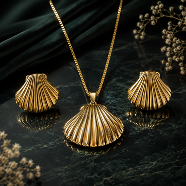 Golden shell-inspired fan pendant necklace with matching textured earrings