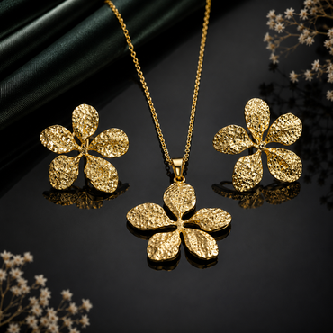 Golden textured floral pendant necklace with matching flower earrings