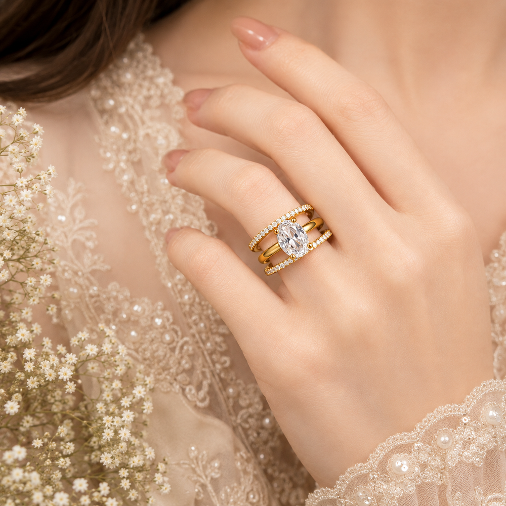 Golden triplet American diamond ring with large oval-cut center stone and sparkling triple bands