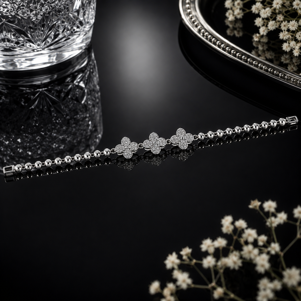 Silver-tone beaded bracelet with three sparkling floral crystal accents