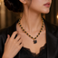 Black beaded necklace with elegant swan-shaped pendant