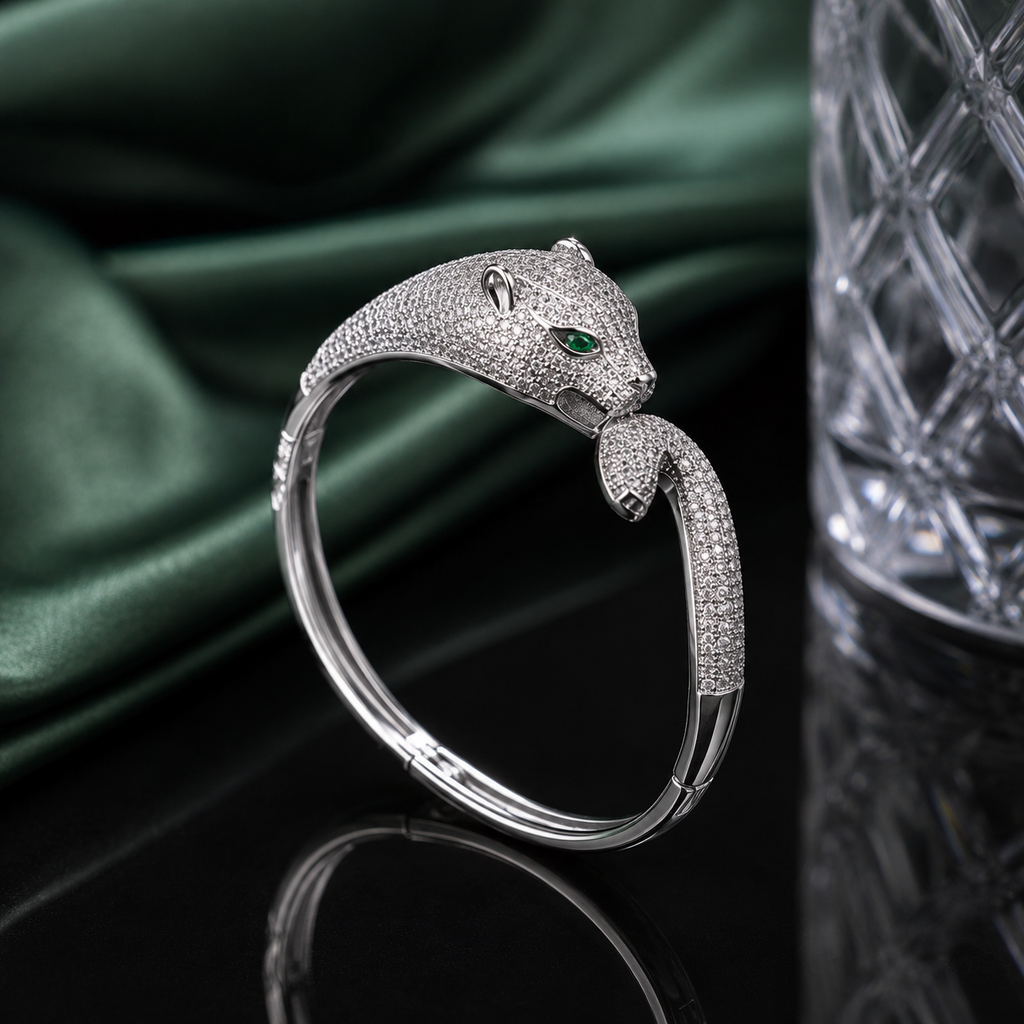 Luxury leopard head CZ cuff bracelet with sparkling stones and green eye accents in gold and silver-tone finishes
