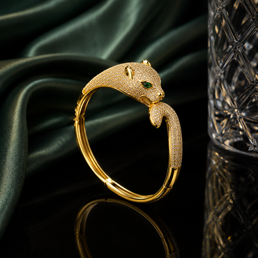 Luxury leopard head CZ cuff bracelet with sparkling stones and green eye accents in gold and silver-tone finishes