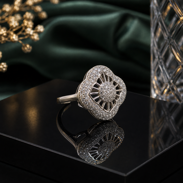 Elegant silver-tone CZ statement ring with sparkling round center stone and intricate halo frame