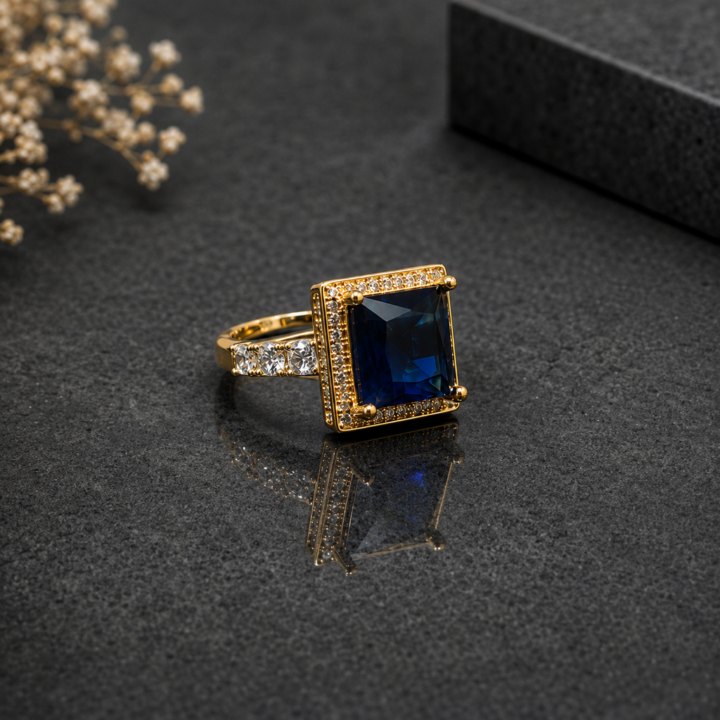 Royal blue rectangular CZ statement ring with sparkling stones and gold-tone setting