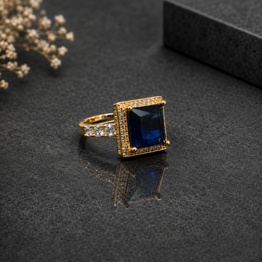 Royal blue rectangular CZ statement ring with sparkling stones and gold-tone setting