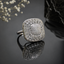 Elegant silver CZ square statement ring with sparkling pavé center and intricate stone detailing