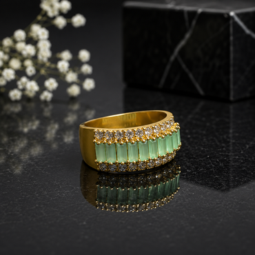 Elegant gold-tone green crystal statement ring with sparkling CZ stone detailing and wide band design