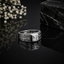 Elegant silver geometric CZ statement ring with square-cut center stone, pavé detailing and modern pattern design