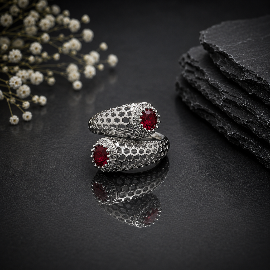 Elegant silver honeycomb statement ring with deep red round-cut center stone and sparkling CZ detailing