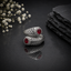 Elegant silver honeycomb statement ring with deep red round-cut center stone and sparkling CZ detailing