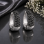 Elegant silver CZ hoop statement earrings with sparkling clear stones and polished silver-tone finish