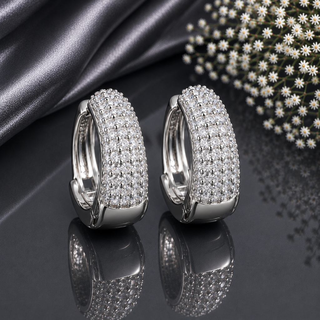 Elegant silver CZ hoop statement earrings with sparkling clear stones and polished silver-tone finish
