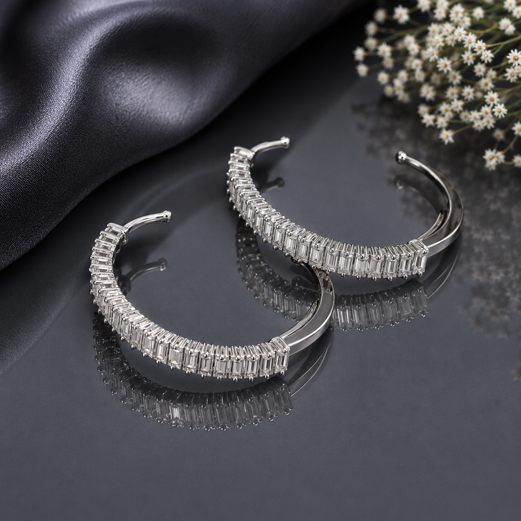 Elegant silver CZ baguette hoop earrings with sparkling rectangular stones in a polished modern design