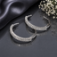 Elegant silver CZ baguette hoop earrings with sparkling rectangular stones in a polished modern design