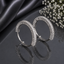 Elegant silver CZ baguette hoop earrings with sparkling rectangular stones in a polished modern design