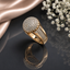Luxury gold-tone round crystal statement ring with sparkling stone detailing