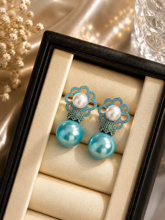 Elegant blue floral pearl drop earrings with turquoise beads and pearl detailing