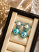 Elegant blue floral pearl drop earrings with turquoise beads and pearl detailing