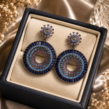 Luxury blue and purple crystal statement earrings with intricate circular detailing