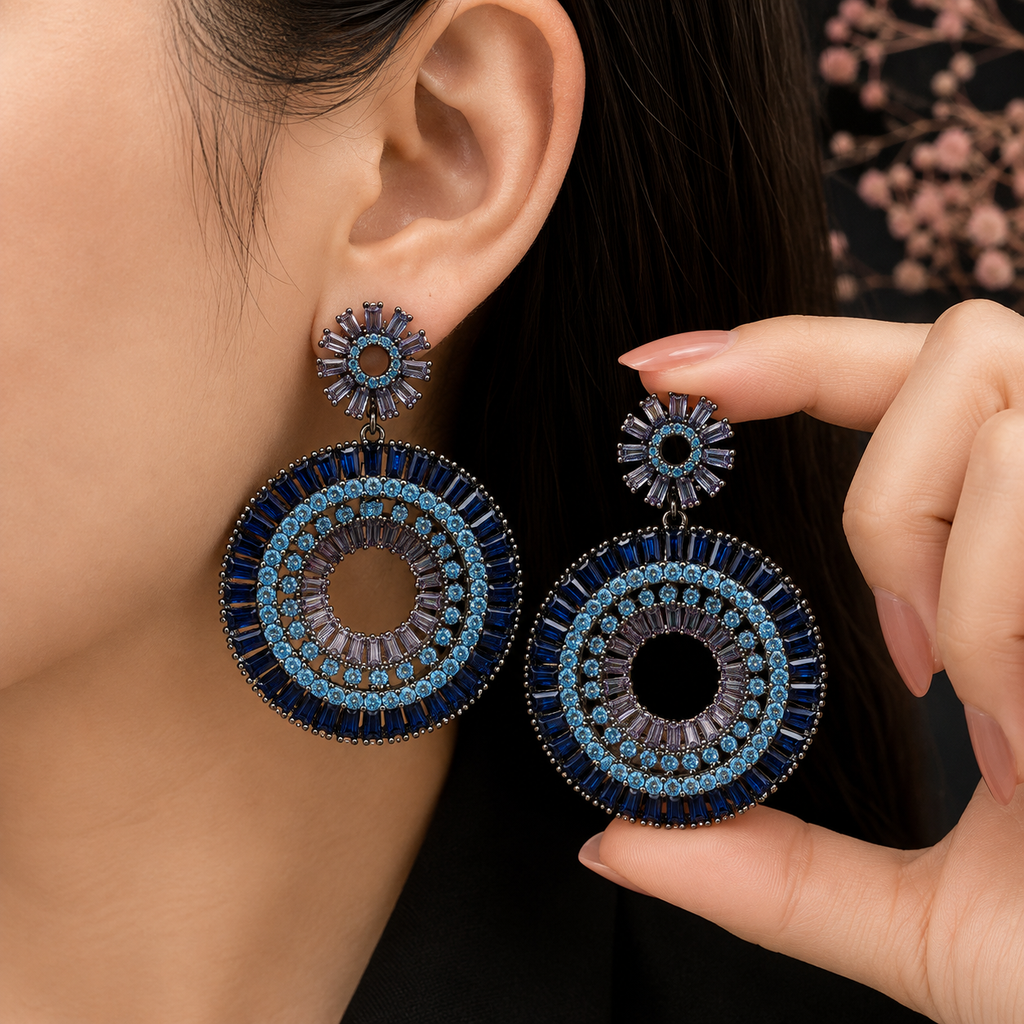 Luxury blue and purple crystal statement earrings with intricate circular detailing