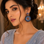 Luxury blue and purple crystal statement earrings with intricate circular detailing