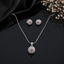 Elegant silver-tone crystal pendant set with matching earrings and pink crystal accents