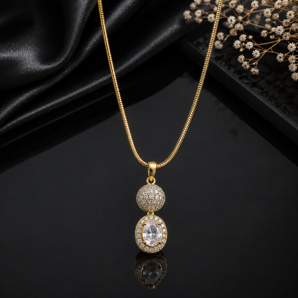Elegant gold-tone oval crystal pendant necklace with sparkling stone detailing