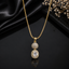 Elegant gold-tone oval crystal pendant necklace with sparkling stone detailing
