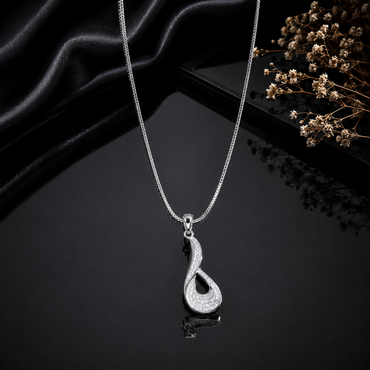 Elegant silver-tone infinity loop pendant necklace with sparkling clear stone detailing and sleek chain