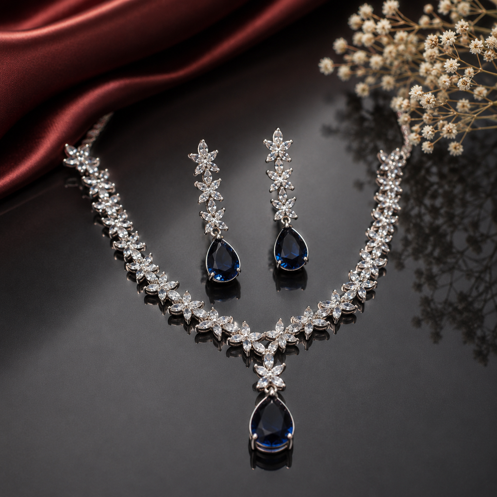 Elegant blue sapphire American Diamond necklace set with floral detailing and matching teardrop earrings