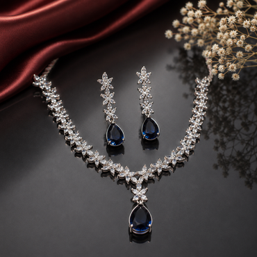 Elegant blue sapphire American Diamond necklace set with floral detailing and matching teardrop earrings