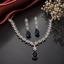 Elegant blue sapphire American Diamond necklace set with floral detailing and matching teardrop earrings