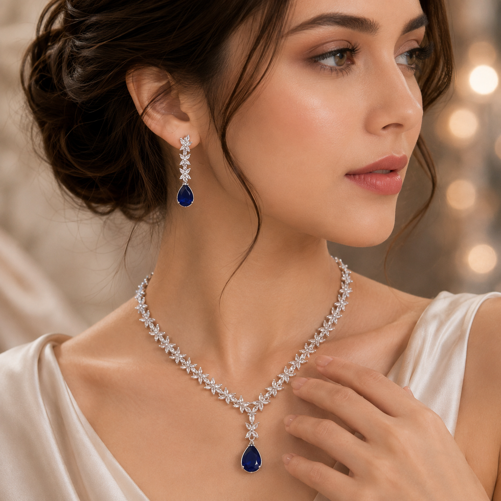 Elegant blue sapphire American Diamond necklace set with floral detailing and matching teardrop earrings